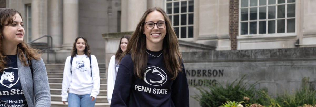 Students walking in front of Henderson Building
