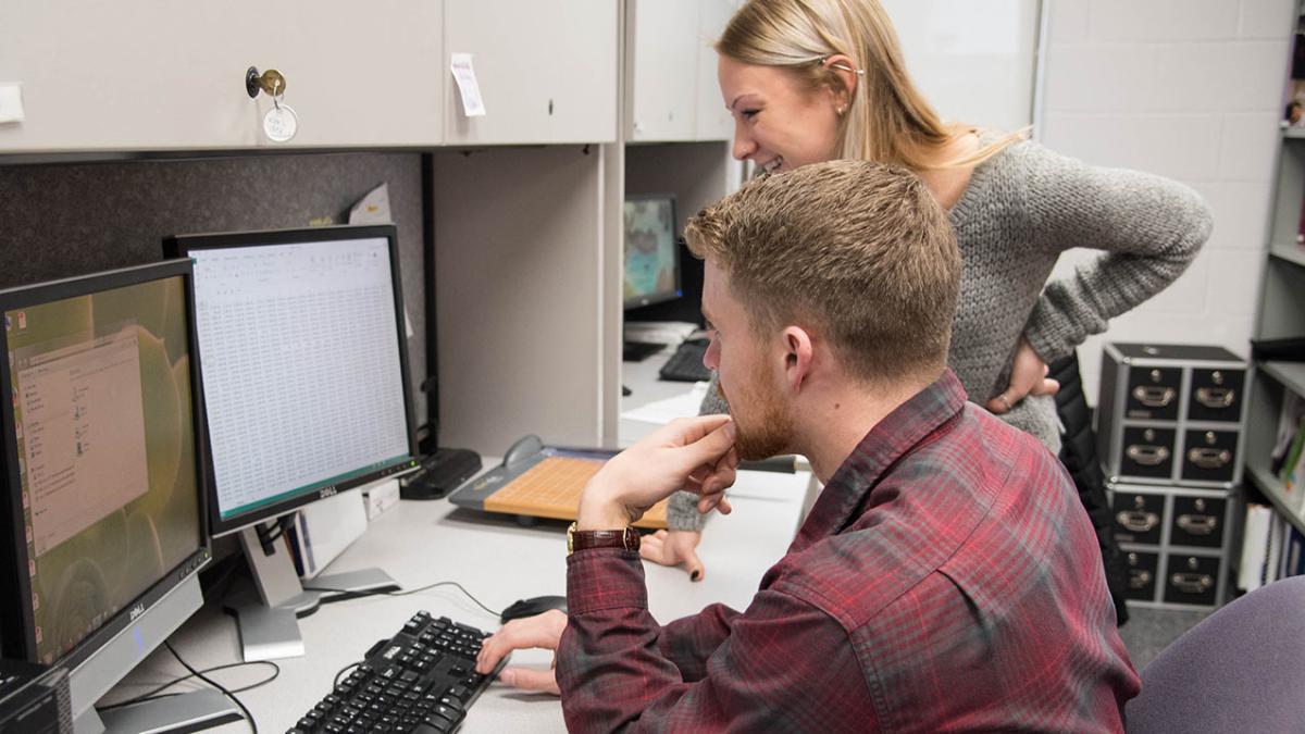 Researchers reviewing clinical data.