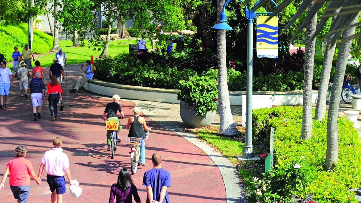 People walking in an urban park area.