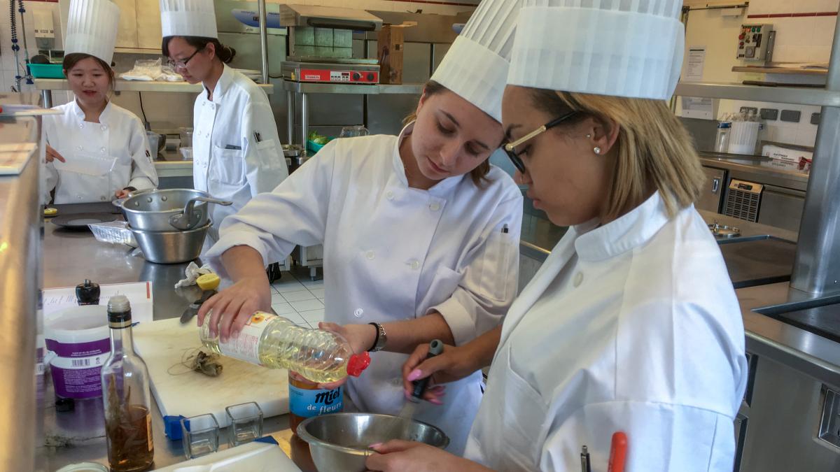 Students conducting research in an international research kitchen.